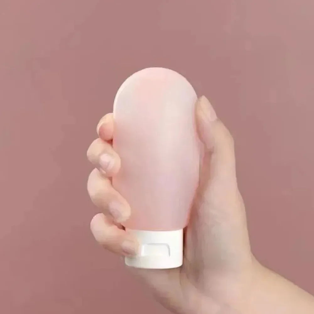 Empty bottles packaged in soft silicone squeeze tubes, refillable water bottles, available for bulk purchase